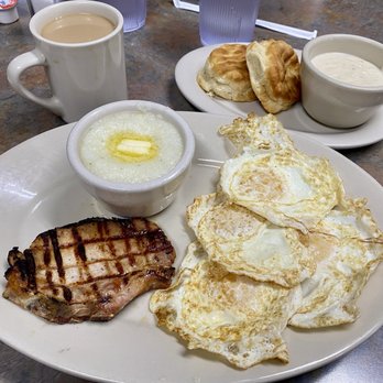 The Depot Cafe - Grilled pork chop and eggs with grits and biscuits and gravy. - American Near Me - Frisco, Texas The Depot Cafe - Grilled pork chop and eggs with grits and biscuits and gravy. - American Near Me - Frisco, Texas