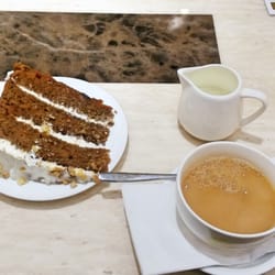 CREAMS British Luxury - A huge slice of carrot cake with tea.