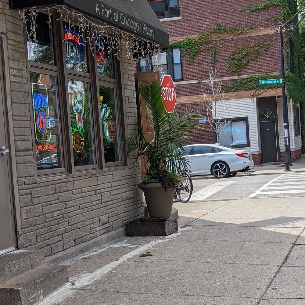 Lottie's Pub - a stop sign on the sidewalk - Pubs Near Me - Chicago, Illinois Lottie's Pub - a stop sign on the sidewalk - Pubs Near Me - Chicago, Illinois