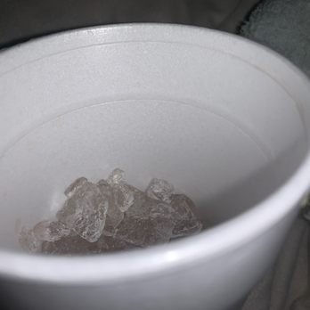 Thai Xpress - a white cup with ice in it - Thai Near Me - Southfield, Michigan