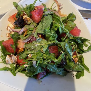 Moonstruck - Watermelon salad with feta, arugula, currants, red onion and pistachio nuts - American Near Me - Asbury Park, New Jersey Moonstruck - Watermelon salad with feta, arugula, currants, red onion and pistachio nuts - American Near Me - Asbury Park, New Jersey