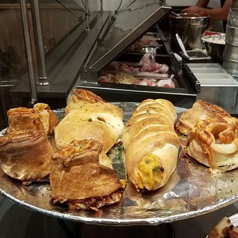 Empire Pizza - Pinwheel, calzone and stromboli (long one) on a tray up front - Pizza Near Me - Houston, Texas Empire Pizza - Pinwheel, calzone and stromboli (long one) on a tray up front - Pizza Near Me - Houston, Texas