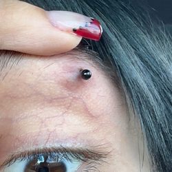 Artistry Salon & Day Spa - bruised piercing