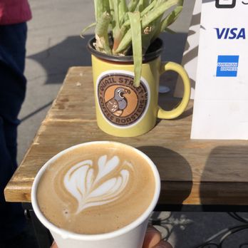 Dune and Sea Coffee - a person holding a cup of coffee - Coffee & Tea Near Me Dune and Sea Coffee - a person holding a cup of coffee - Coffee & Tea Near Me