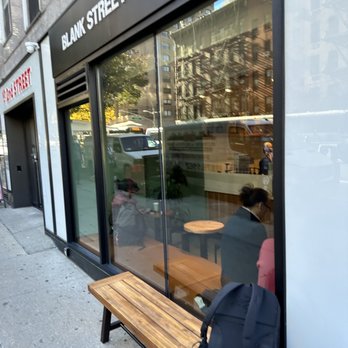 Blank Street Coffee - a bench outside a coffee shop - Coffee & Tea Near Me - New York, New York
