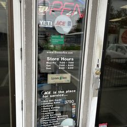 Green's Ace Home Center - Front door with hours