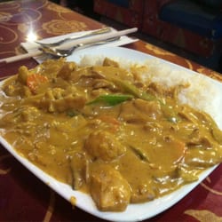 Thick green chicken coconut curry on rice
