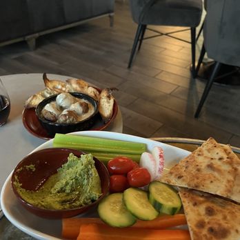 Terry's Restaurant + Lounge - Meatball in background, green hummus appetizer in foreground. - Lounges Near Me - Carmel, California