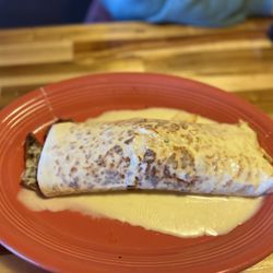El Mesquite Mexican Bar & Grill - Fajita burrito with cheese sauce. Awesome.