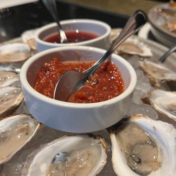 The Dining Room at The Vanderbilt - a platter of oysters and sauce - New American Near Me - Newport, Rhode Island The Dining Room at The Vanderbilt - a platter of oysters and sauce - New American Near Me - Newport, Rhode Island