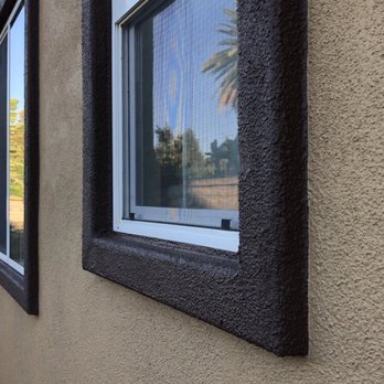 Casa Painting Services - Walls and raised window trim are both stucco so trim had to be hand painted, no tape or guide. Look how straight the color boundary is. - Painters Near Me - Northridge, California