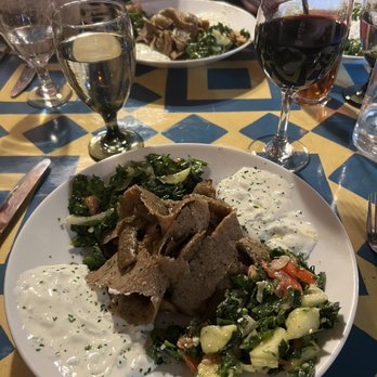 Marlaina's Mediterranean Kitchen - Red blend and the gyro plate. Freshly baked pita underneath the yummy salad and gyro meat. - Mediterranean Near Me - Burien, Washington
