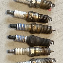 EXTON TIRE - The spark plugs that came out of my van. After Exton Tire told me they had put in the brand new spark plugs a year before.