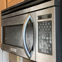 Property Management Service Utah - Microwave caked with grease. We had to toss it