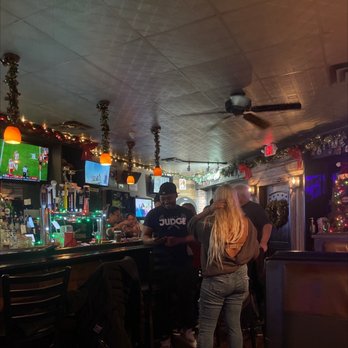 Brews Brothers Grille - a man and a woman at a bar - Sports Bars Near Me - Franklin Square, New York