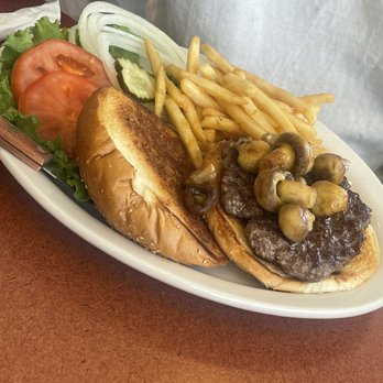 Margie's Diner - My son's mushroom burger. We had already stolen a few mushrooms when this picture was snapped. They were delicious! - Diners Near Me - Paso Robles, California