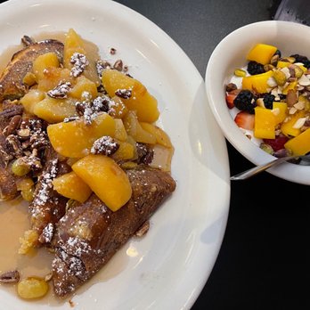 Perly's - Cinnamon babka French toast (left) and the yogurt/fruit/nut side dish - Delis Near Me - Richmond, Virginia