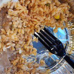 Chevo's Mexican Restaurant - Partially eaten Beans and rice. This was so good. Absolutely decisions. This was a side Portion and only cost $2.50.