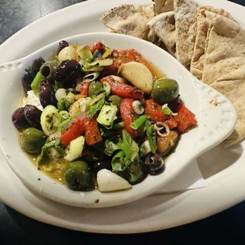 Romeo's Euro Café - Greka appetizer- baked feta cheese, garlic cloves, olives, roasted red peppers, scallions, rosemary w/ pita bread - Greek Near Me - Gilbert, Arizona Romeo's Euro Café - Greka appetizer- baked feta cheese, garlic cloves, olives, roasted red peppers, scallions, rosemary w/ pita bread - Greek Near Me - Gilbert, Arizona
