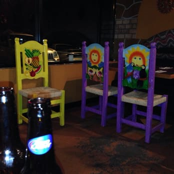 Santiago's Viii Mexican Restaurant - two colorful chairs and a bottle of beer - Mexican Near Me - Johnstown, Colorado Santiago's Viii Mexican Restaurant - two colorful chairs and a bottle of beer - Mexican Near Me - Johnstown, Colorado