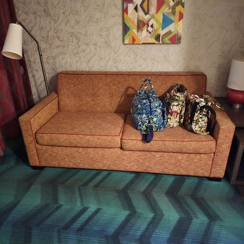 Home2 Suites by Hilton Lafayette - Couch (looks like from the 70s) with mom's bags. - Hotels Near Me - Lafayette, Indiana Home2 Suites by Hilton Lafayette - Couch (looks like from the 70s) with mom's bags. - Hotels Near Me - Lafayette, Indiana