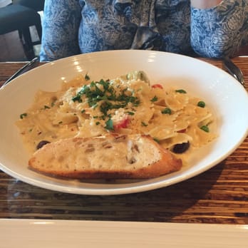 Sage Student Bistro - Pasta Parm with olives, artichoke hearts, tomatoes, peas, bacon and parmesan cream sauce. - New American Near Me - Omaha, Nebraska