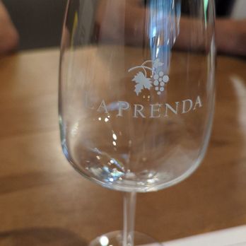 La Prenda Wines - a wine glass on a table - Wine Tasting Room Near Me - Sonoma, California La Prenda Wines - a wine glass on a table - Wine Tasting Room Near Me - Sonoma, California