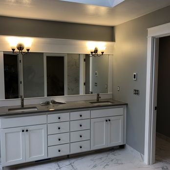 The Construction Compass - a bathroom with double sinks - General Contractors Near Me The Construction Compass - a bathroom with double sinks - General Contractors Near Me