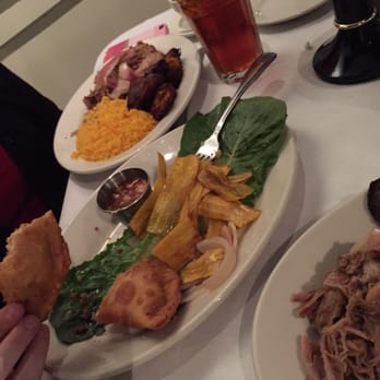 Sweet Potatoes - What's left of the sampler and a delicious roasted pork entree with plantains. - Southern Near Me - Winston-Salem, North Carolina