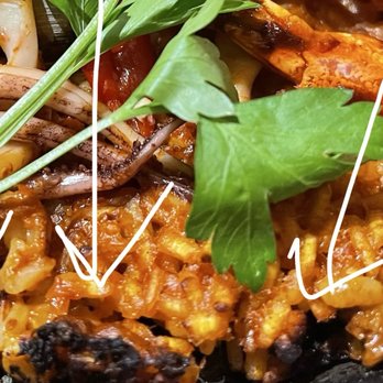 Barcelona Wine Bar - Look at the charred edges. Looks rice leftovers stuck to the bottom of the pot. In Spanish it's called "pegao" - Tapas/Small Plates Near Me - Delray Beach, Florida