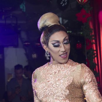 Friend's Tavern - a woman dancing in a club - Gay Bars Near Me - Jackson Heights, New York