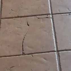 Sun Realty - These are cracked tiles which underneath are the soft spots of the subfloor.
