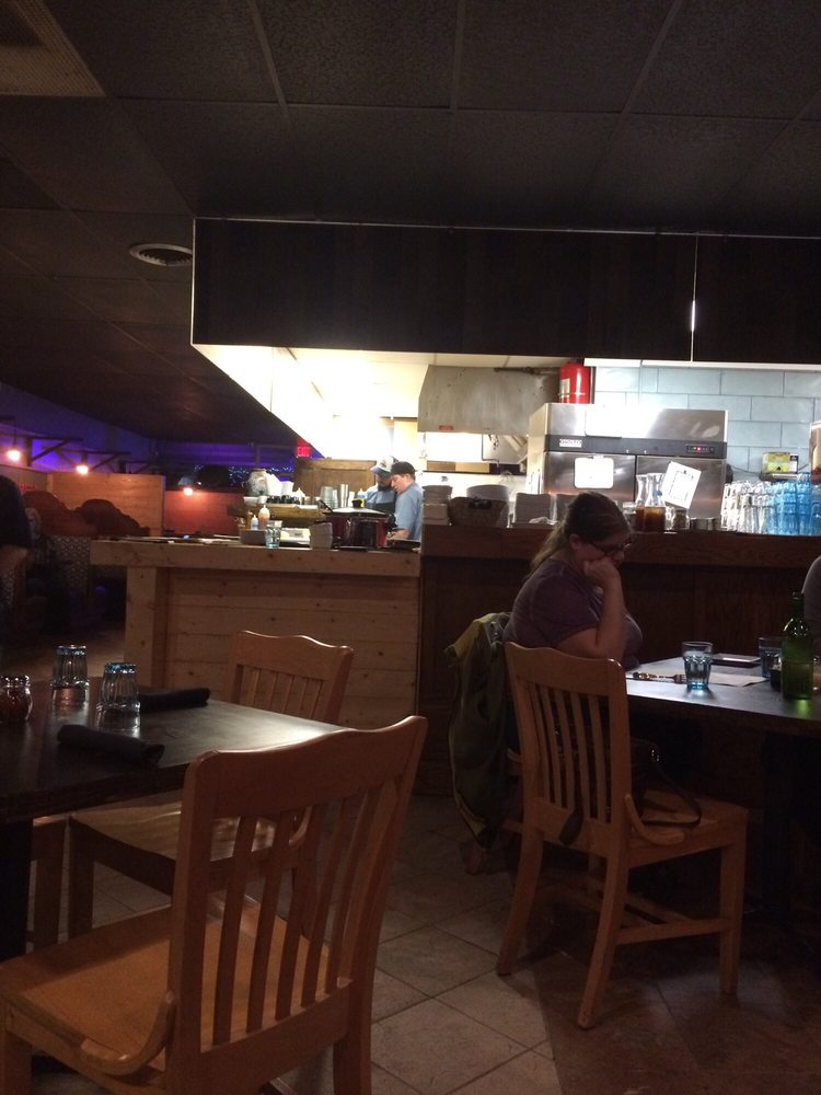 Seating area overlooking the open kitchen. Yelp