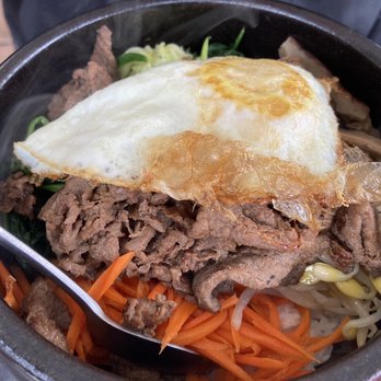 Go Go 7 - Beef Bibimbap features (over)fried egg atop - Korean Near Me - San Francisco, California Go Go 7 - Beef Bibimbap features (over)fried egg atop - Korean Near Me - San Francisco, California