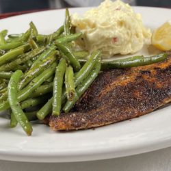 Blackened Redfish with southern style potato salad and french beans.
