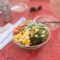 Poke Loa - Mixed base of greens & brown rice w/3 scoops: tuna, salmon, & octopus! A mixture of the wasabi aioli & the lemon sauce.