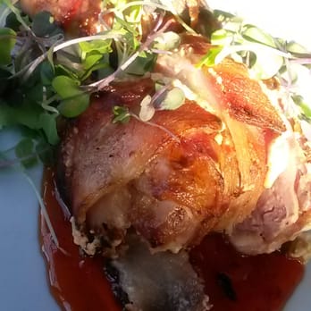Foxhole Culinary Tavern - Stuffed quail with the light shining down on its yumminess - New American Near Me - Austin, Texas Foxhole Culinary Tavern - Stuffed quail with the light shining down on its yumminess - New American Near Me - Austin, Texas