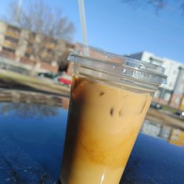 a cold beverage in a plastic cup a cold beverage in a plastic cup