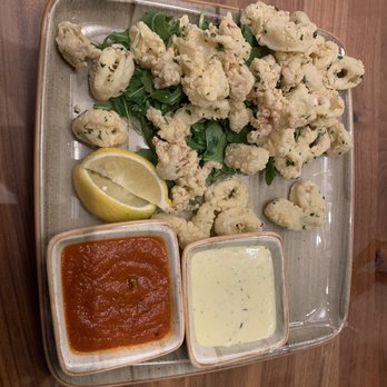 Hyatt Regency Seattle - Calamari with lemon dipping sauce and tomato based dipping sauce. Excellent - Hotels Near Me - Seattle, Washington Hyatt Regency Seattle - Calamari with lemon dipping sauce and tomato based dipping sauce. Excellent - Hotels Near Me - Seattle, Washington