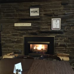 Kristofor's - Cozy fireplace on the bar side.