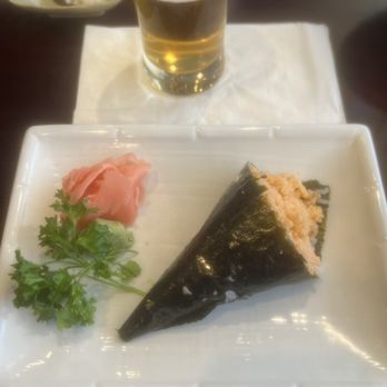 Sakura Japanese Restaurant - My camera is shattered but this is a spicy scallop hand roll. Super good! (2nd one even though the first one was crumbly... let's go! - Japanese Near Me - Mchenry, Illinois