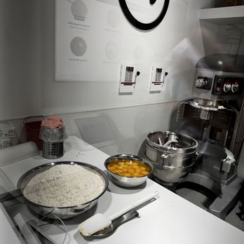 Crumbl - Issaquah - a kitchen with a white counter and a white stove - Bakeries Near Me - Issaquah, Washington