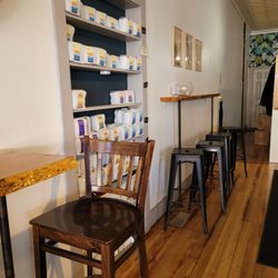 Catalpa Coffee - Indoor seating by the counter, and coffee beans for sale