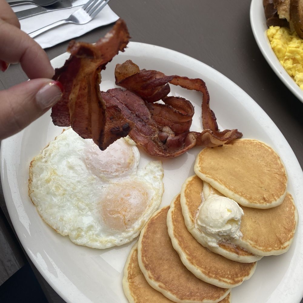 Eggs over easy with bacon and pancakes Eggs over easy with bacon and pancakes