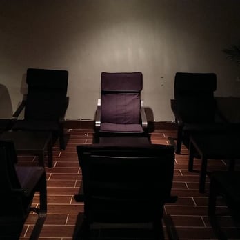Eclipse Hookah Lounge - a group of chairs in a dimly lit room - Hookah Bars Near Me - Philadelphia, Pennsylvania Eclipse Hookah Lounge - a group of chairs in a dimly lit room - Hookah Bars Near Me - Philadelphia, Pennsylvania
