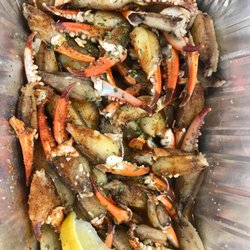 Steamed blue crab claws with garlic butter.