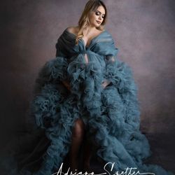 Blessed Moments Photography - Maternity photo of a beautiful mama wearing a grey couture robe standing in front of a charcoal backdrop