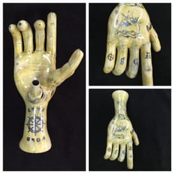 Holy Smokes - Tattooed hand pipe made by Phil