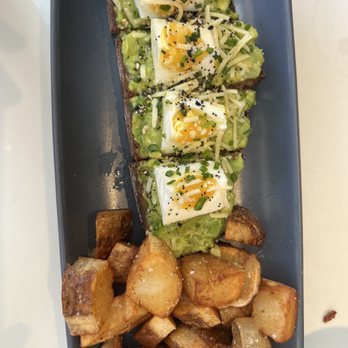 The Henry - Avocado toast and a side of potatoes which I put onto one plate- ordered separately. - Coffee & Tea Near Me - Coronado, California
