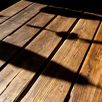 Queen Gypsy - the shadow of a umbrella on a wooden table - Modern European Near Me - Brampton, Ontario